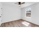 Bright bedroom with wood-look flooring and a ceiling fan at 4251 Canby Ln, Decatur, GA 30035