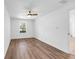 Bright bedroom featuring hardwood floors and a ceiling fan at 4251 Canby Ln, Decatur, GA 30035