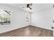 Bright bedroom with a ceiling fan, wood-look flooring, and two windows at 4251 Canby Ln, Decatur, GA 30035