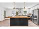 Bright kitchen with a large island, stainless steel appliances, and sleek white cabinets at 4251 Canby Ln, Decatur, GA 30035