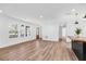 Bright open-concept living area featuring hardwood floors, modern lighting, and ample space at 4251 Canby Ln, Decatur, GA 30035