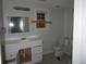 Bathroom featuring a single sink vanity and a toilet at 7 Whatley Se St, Atlanta, GA 30315