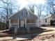 Charming bungalow-style home with a cozy front porch and shaker siding at 7 Whatley Se St, Atlanta, GA 30315