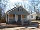Charming bungalow-style home with a cozy front porch and shaker siding at 7 Whatley Se St, Atlanta, GA 30315
