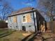 Rear view of a home with a grassy yard and access stairs at 7 Whatley Se St, Atlanta, GA 30315