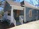 Side view of a home featuring a welcoming front porch and concrete steps at 7 Whatley Se St, Atlanta, GA 30315