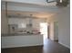Kitchen view showcasing white cabinets, granite countertops, stainless steel sink, and open layout at 7 Whatley Se St, Atlanta, GA 30315
