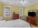 Bedroom features two large windows and wooden floors, with plenty of natural light at 740 Azalea Ave, Mcdonough, GA 30253