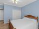 A comfortable bedroom with light blue walls, hardwood floors, and a spacious closet at 740 Azalea Ave, Mcdonough, GA 30253