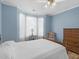 Bedroom with large bay window and side table to compliment the hard wood floors at 740 Azalea Ave, Mcdonough, GA 30253
