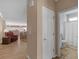 Interior shot showcasing the hallway leading to the bathroom with the living room visible in the background at 740 Azalea Ave, Mcdonough, GA 30253
