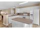 Functional kitchen featuring white cabinetry, a central island, and modern appliances at 740 Azalea Ave, Mcdonough, GA 30253