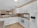 Bright kitchen features white cabinets, modern appliances, and a seamless open design at 740 Azalea Ave, Mcdonough, GA 30253