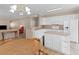 Bright kitchen with white cabinets, an island, and an open layout, perfect for cooking and socializing at 740 Azalea Ave, Mcdonough, GA 30253