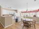 Open kitchen and dining area with white cabinets and a large island, ideal for entertaining at 740 Azalea Ave, Mcdonough, GA 30253