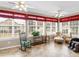Inviting sunroom is filled with natural light, perfect for relaxation and features lots of windows at 740 Azalea Ave, Mcdonough, GA 30253
