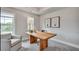 Home office featuring a modern desk, art, natural light, and a comfortable chair at 1696 Lansmere Sw St, Marietta, GA 30008