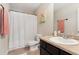 Bathroom with vanity, toilet, shower with white curtain and neutral colors with a tile floor at 3975 Silverthorn Trce, Cumming, GA 30028
