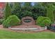 Manicured entrance sign for Hunters Walk community surrounded by lush greenery at 3975 Silverthorn Trce, Cumming, GA 30028