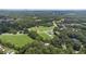 Expansive aerial view of a sprawling property with lush greenery and a beautiful home at 5809 Warren Farm Sw Rd, Powder Springs, GA 30127