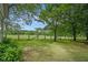 Spacious backyard with lush greenery and a well-maintained fence, offering privacy and scenic views at 5809 Warren Farm Sw Rd, Powder Springs, GA 30127