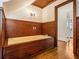 Bathroom with paneled wainscotting, vanity and wooden bath tub at 5809 Warren Farm Sw Rd, Powder Springs, GA 30127