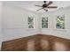 Bright bedroom with hardwood floors and large windows providing ample natural light at 5809 Warren Farm Sw Rd, Powder Springs, GA 30127