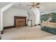 Bonus room features carpet, fireplace, and a beautiful hand-painted armoire at 5809 Warren Farm Sw Rd, Powder Springs, GA 30127
