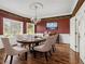 Formal dining room featuring hardwood floors, decorative molding, and an elegant chandelier at 5809 Warren Farm Sw Rd, Powder Springs, GA 30127