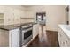 Spacious kitchen with stainless steel oven and a view into the dining room at 5809 Warren Farm Sw Rd, Powder Springs, GA 30127