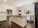 Bright kitchen featuring a center island, white cabinetry, and stainless steel appliances at 5809 Warren Farm Sw Rd, Powder Springs, GA 30127