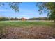 A pastoral field of grass beneath a bright blue sky at 5809 Warren Farm Sw Rd, Powder Springs, GA 30127