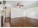 Bright living room with hardwood floors and a ceiling fan, complemented by a charming fireplace at 5809 Warren Farm Sw Rd, Powder Springs, GA 30127