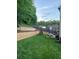 Spacious backyard showcasing a playset, a patio set and a retaining wall at 3952 Rhyne Way, Smyrna, GA 30082