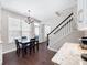 View of kitchen breakfast nook and staircase; with dark wood flooring and white cabinetry at 3952 Rhyne Way, Smyrna, GA 30082