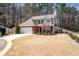 Charming two-story home with a brick facade, attached garage, and well-manicured lawn at 3952 Rhyne Way, Smyrna, GA 30082