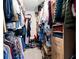 This walk-in closet is filled with lots of clothing and accessories at 3952 Rhyne Way, Smyrna, GA 30082