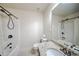 Well-lit bathroom with a shower-tub combination and granite countertop at 5825 Trailwood Ct, Suwanee, GA 30024