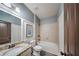 Bathroom featuring a tub shower, granite countertops, and tile flooring at 5825 Trailwood Ct, Suwanee, GA 30024
