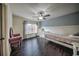 Charming bedroom with hardwood floors, built-in shelves, and lots of natural light at 5825 Trailwood Ct, Suwanee, GA 30024