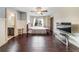 Spacious bedroom with hardwood flooring, natural light, and TV at 5825 Trailwood Ct, Suwanee, GA 30024