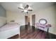 Spacious bedroom showcasing hardwood floors and a stylish purple vanity at 5825 Trailwood Ct, Suwanee, GA 30024