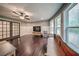 Bright bonus room with hardwood floors, large windows, TV, and comfortable seating at 5825 Trailwood Ct, Suwanee, GA 30024