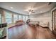 Cozy bonus room features hardwood floors, large windows, and comfortable seating at 5825 Trailwood Ct, Suwanee, GA 30024