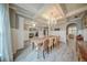 Bright and spacious dining room showcasing stylish chandelier, and luxury vinyl plank flooring at 5825 Trailwood Ct, Suwanee, GA 30024