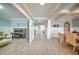 Elegant dining room with coffered ceilings, wainscoting, and wood-look floors at 5825 Trailwood Ct, Suwanee, GA 30024