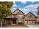 Charming two-story brick home with manicured landscaping and a welcoming front porch at 5825 Trailwood Ct, Suwanee, GA 30024