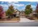 Beautiful two-story brick home with mature trees and a well-maintained front yard at 5825 Trailwood Ct, Suwanee, GA 30024