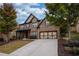 Beautiful two-story brick home with a well-maintained front yard and inviting curb appeal at 5825 Trailwood Ct, Suwanee, GA 30024
