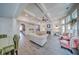 An open concept great room features hardwood floors, natural light, and comfortable seating at 5825 Trailwood Ct, Suwanee, GA 30024